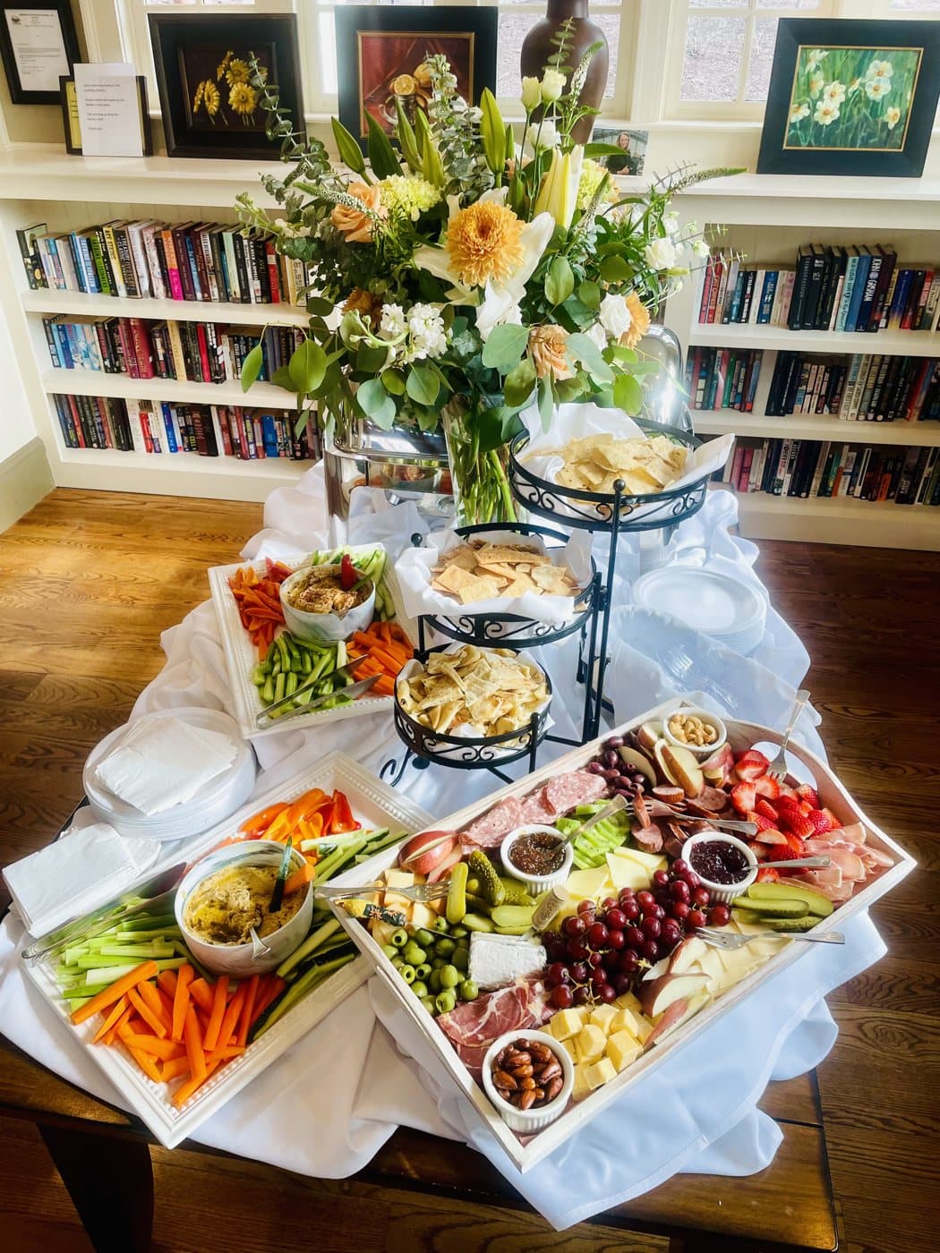A catered spread by Smokin' Mike's: charcuterie board, vegetable trays and dips